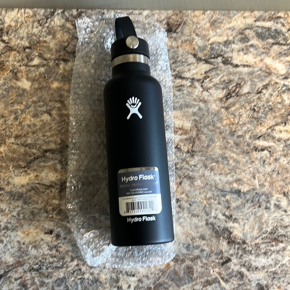 Hydroflask 21 oz water bottle in black, with “The Highlands” on one side NWT